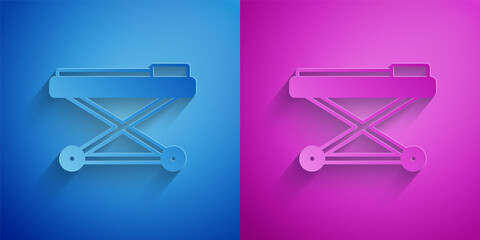 Sticker - Paper cut Stretcher icon isolated on blue and purple background. Patient hospital medical stretcher. Paper art style. Vector