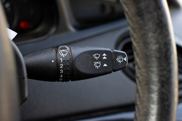 windscreen wiper control adjustment lever switch in a modern car,car interior.