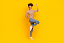 Full Size Photo Of Young Excited Lady Rejoice Luck Triumph Fists Hands Champion Isolated Over Yellow Color Background