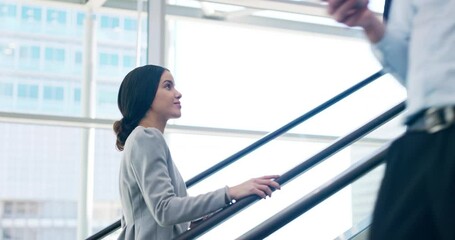 Poster - Shes on her way to the top. 4k video footage of an attractive young businesswoman going up the escalator at work.