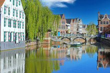Beautiful Belgian Landscapes - View Over Water Village Moat Canal On Ancient Houses, Green Weeping Willow Tree, Medieval Stone Arch Bridge, Blue Clear Sky - Lier, Belgium