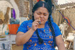 woman applying monkfish ancestral medicine in Mexico