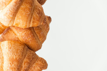 Wall Mural - Close up shot of a bunch of homemade croissants on white background.