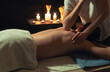 © Small365 - Therapist gives the back massage.Deep tissue massage with an elbow.Spa centre concept