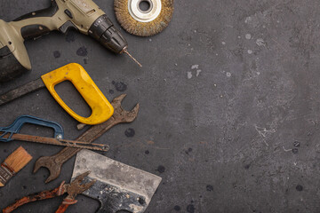 Labour day background concept - different construction tools on dark stone background with copy space. Father's day