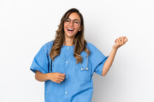 Young Surgeon Doctor Woman Over Isolated White Wall Making Guitar Gesture