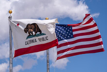 California State Flag And USA Flag Blowing In The Wind