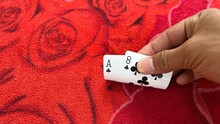 Casino Playing Card On The Table Isolation Background At Casino Border, Kampong Rou District, Svay Reing Province, Cambodia, Casino Element, Casino Poker Over Red Background.