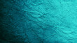 Blue green abstract background. Gradient. Toned rough cracked stone surface. Teal background with space for design.