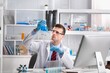 © BillionPhotos.com - Viorolog researcher examining a sample from test tube working in a modern equipped laboratory.