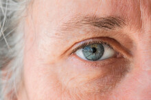 Close Up Of Macro Shot Elderly Man Two Brown Eyes With Pupil And Iris