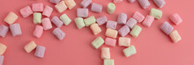 Multicolored Candies On A Pink Background. Close-up
