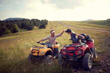 Couple Driving Off-road And Enjoying On Extreme Riding