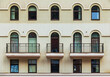 © dr_verner - Three balconies and many windows in a row on the facade of the modern urban apartment building front view, Krasnaya Polyana, Sochi, Krasnodar Krai, Russia