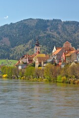 Wall Mural - Frohnleiten,  - small town above Mur river in Styria, Austria. View at Parish church, town and river Mur. Famous travel destination.