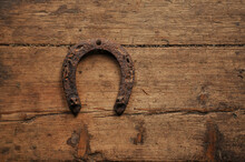 Very Old Shabby Wooden Floor And Rusty Horseshoe