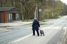 A Woman Crosses The Road In A Non-right Place.
