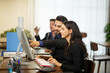 © FotoArtist - business support on telephone in office. young business people chatting in start up office