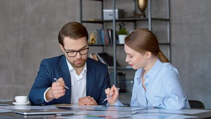 Poster - Two business people talk project strategy at office room