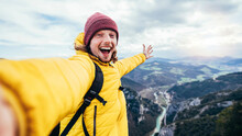 Young Hiker Man Taking Selfie Portrait On The Top Of Mountain - Happy Guy Smiling At Camera - Hiking, Sport, Travel And Technology Concept