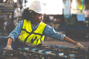 Wall Mural - Printed Circuit Board Motherboard. Woman worker wearing safety  hardhat helmet and working at old factory. Metal lathe industrial manufacturing factory