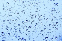 Water Drops On Blue Window Background Wallpaper