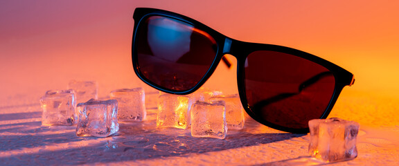 Sunglasses with ice cubes. hot summer concept