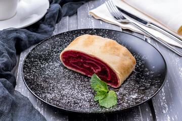 Wall Mural - Cherry strudel with mint on black plate