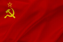 USSR Flag On Waving Silk Background. Fabric Texture Design. Historical Flag Of Soviet Union.