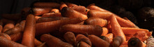 Heap Of Fresh Carrot Vegetable In Local Market. Dramatic Light