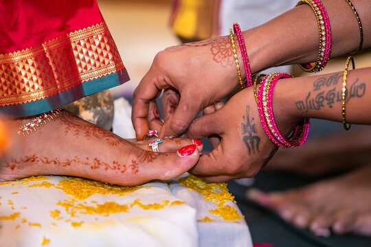 Tamil Hindu wedding ceremony rituals, bride's feet and rings close up