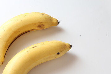 2 bananas on a white background