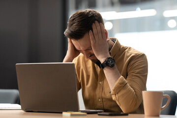 Poster - Unhappy Businessman Near Laptop Touching Head Having Headache In Office