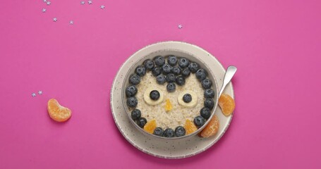 Poster - Stop motion animation of oatmeal with fruits. Healthy breakfast for kids concept