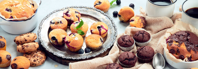 Wall Mural - Muffins assortment on light background.