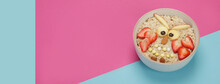 Creative Oatmeal Breakfast For Kids On Colourfull Background.