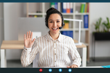Poster - Head shot of cheerful female employee worker waving hand to webcam, greeting colleagues at online meeting, screen view