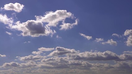 Wall Mural - Cumulus clouds with blue sky on a sunny day of summer. Beautiful cloudscape as nature background panorama. Wonderful weather of natural daylight with white cloud floating, creating a abstract shape