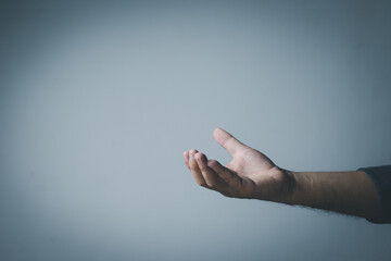 Wall Mural - man's hand concept The man is spreading his hands at the level of his chest. Suitable for making products, products or symbols to put together with pictures.