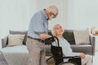 Senior couple, wife takes care of invalid husband