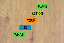 Action Plan Symbol. Concept Words What Is Your Action Plan On Colored Paper. Beautiful Wooden Table Wooden Background. Business What Is Your Action Plan Concept. Copy Space.