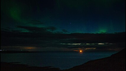 night view of the sea and aurora borealis