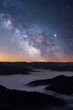 Milkway galaxy rising up over a fog filled valley in the Appalachian Mountains of Kentucky