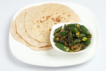 Wall Mural - Bhindi masala or ladies finger fry served with indian roti chapati or Indian Flat bread