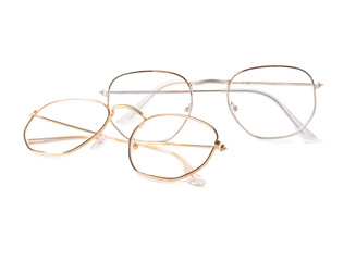 Different modern eyeglasses on white background