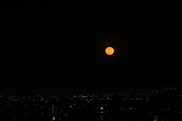 Wall Mural - view of the full moon with few clouds