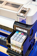 Wide format printer for on fabric and paper