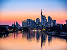 Germany, Hesse, Frankfurt, River Main Canal At Dusk With Bridge And Downtown Skyscrapers In Background