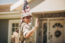 Happy Servicewoman Waving Her Hand On Her Homecoming