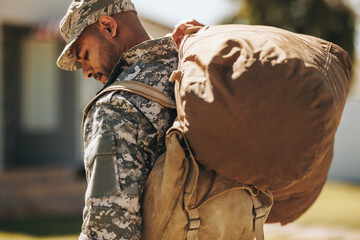 Wall Mural - Brave serviceman returning home from the army